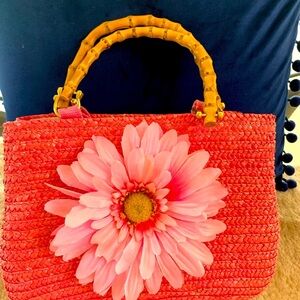 Summer sale!Bright pink wicker purse. 11x8x3Added the flower after purchase.